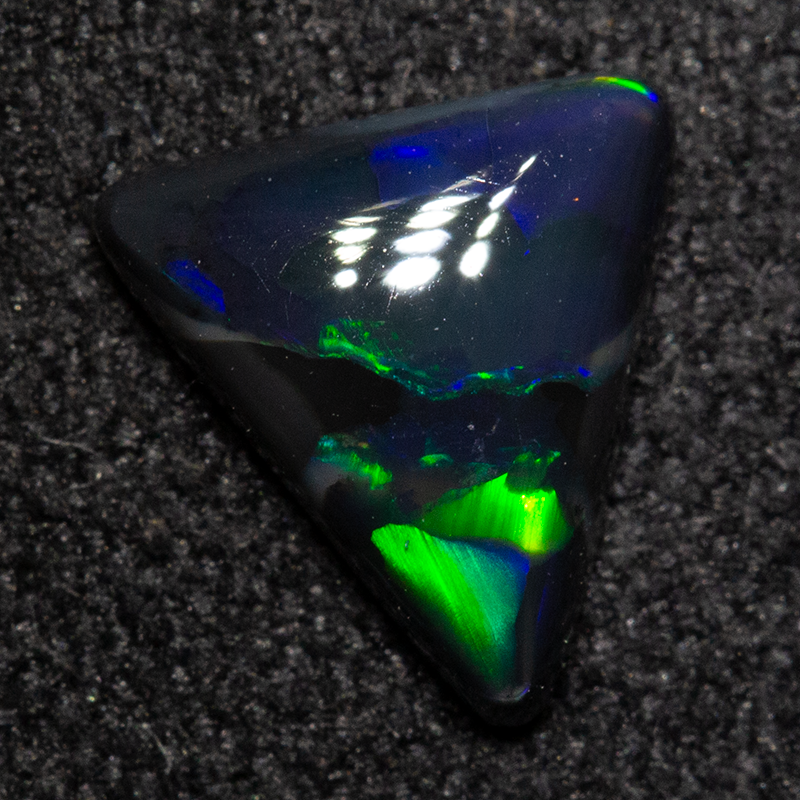 0.61 ct black opal 7.4x7x2.3mm