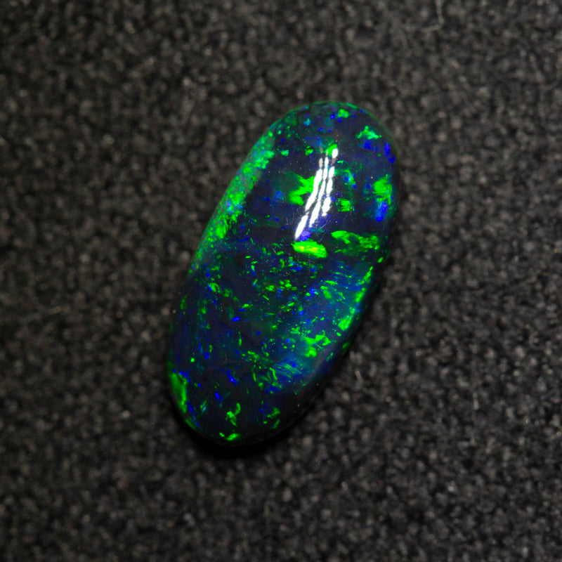 0.61 ct black opal 8.6x4.2x2.6mm