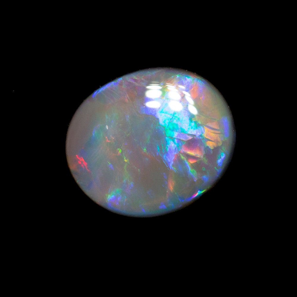 0.61 ct dark opal 6.7x5.8x2.2mm
