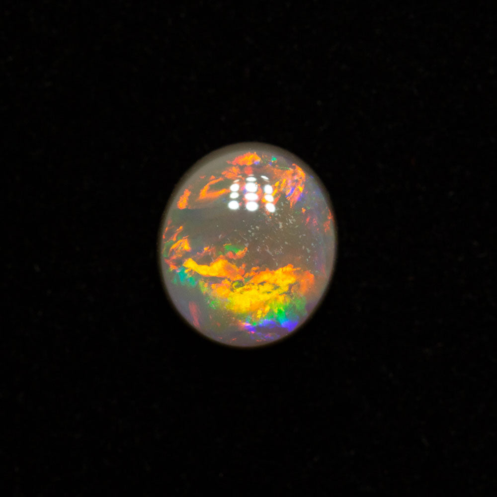 0.62 ct dark opal 5.9x5.1x3mm
