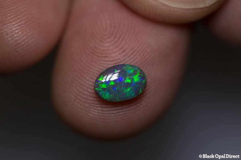 0.62 ct dark opal 7.5x5x2mm