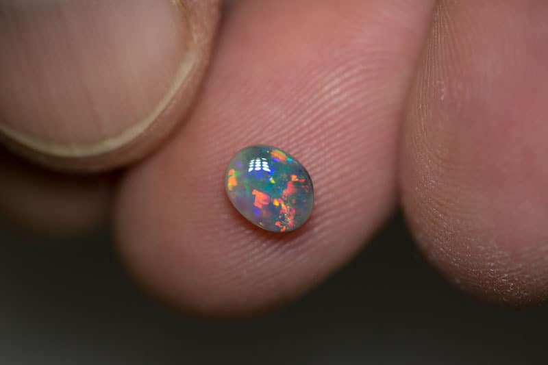 0.62 ct semi black opal 6.5x5x3mm