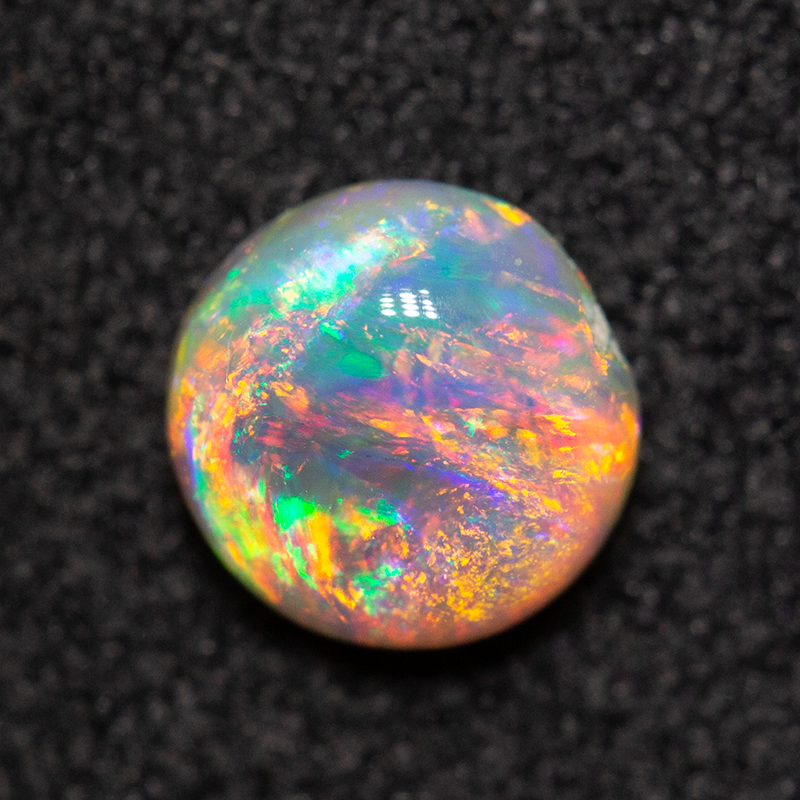0.63 ct dark opal 5.8x5.7x3mm