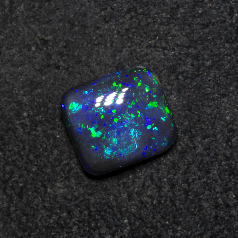 0.64 ct black opal 5.9x5.3x2.6mm