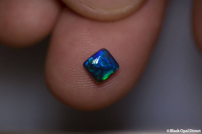 0.64 ct black opal cushion cut 5x5x3mm
