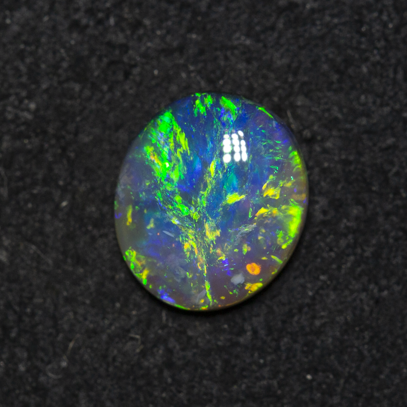 0.65 ct black opal 7.1x6.2x2.5mm