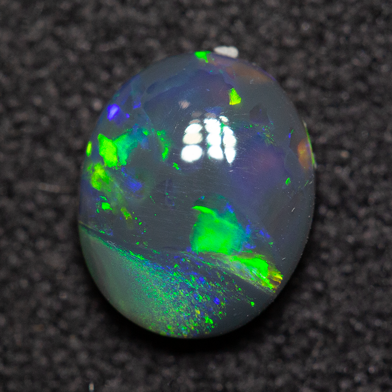 0.65 ct black opal 6.8x5.7x2.6mm