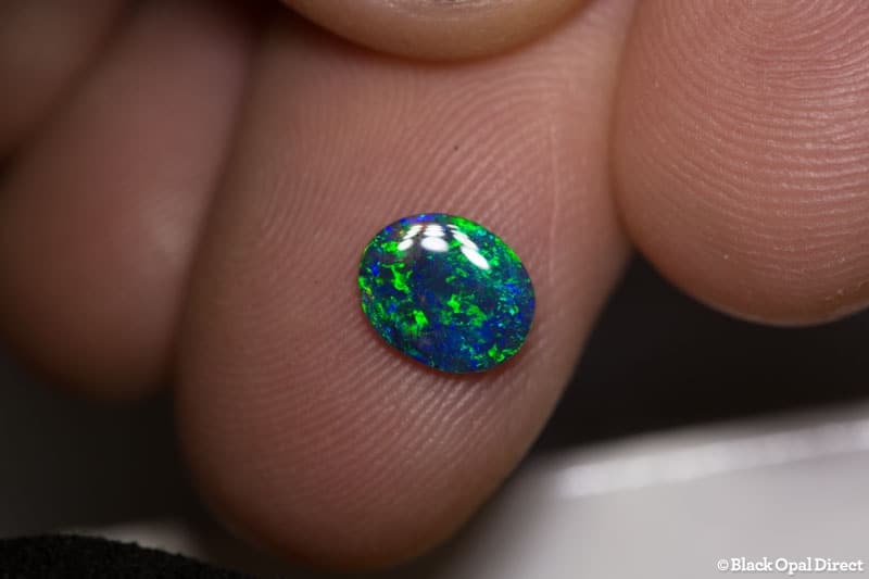 0.65 ct black opal 8x6.5x2mm