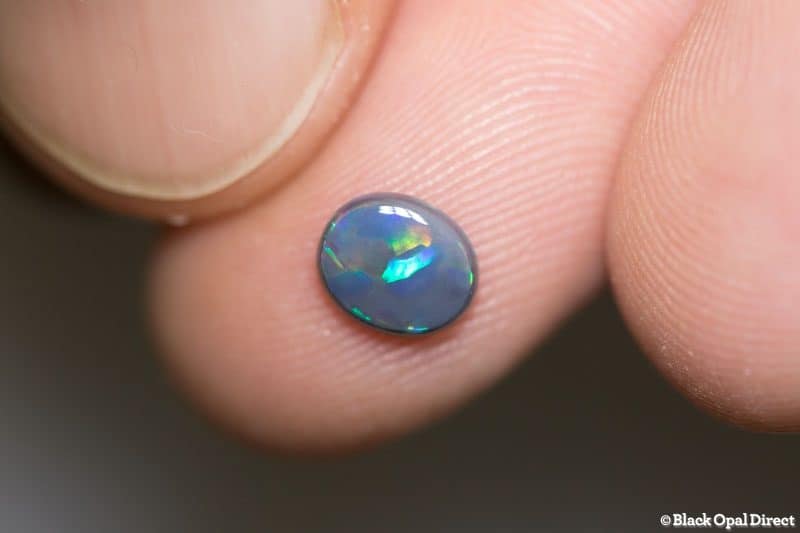 0.65 ct black opal 7x6x2mm