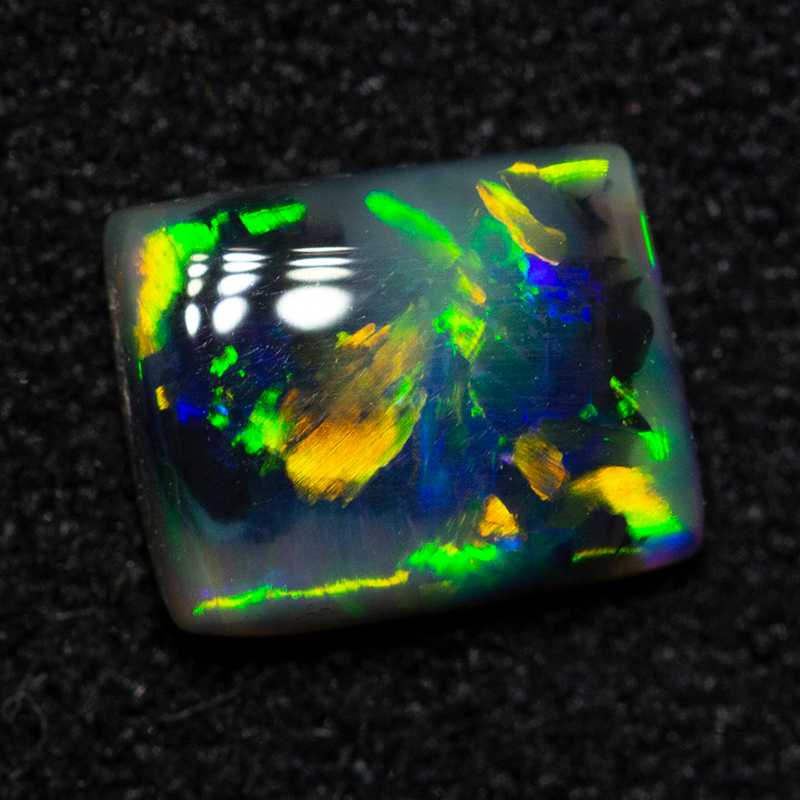 0.66 ct dark opal 6.3x5.1x2.4mm