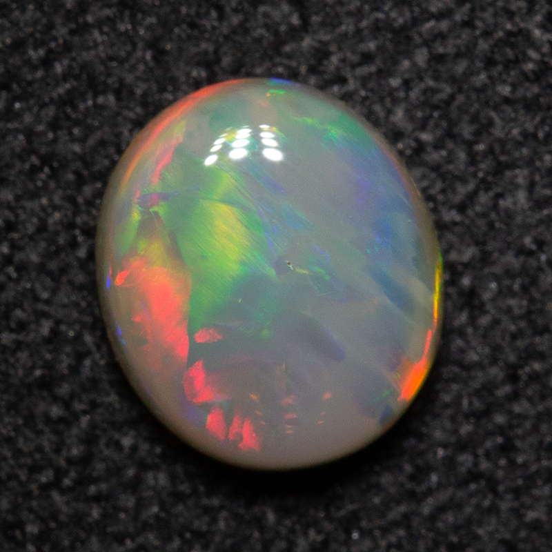 0.67 ct dark opal 6.4x5.5x2.7mm