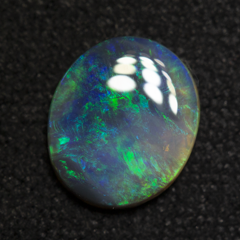 0.67 ct black opal 7.6x6.5x1.8mm