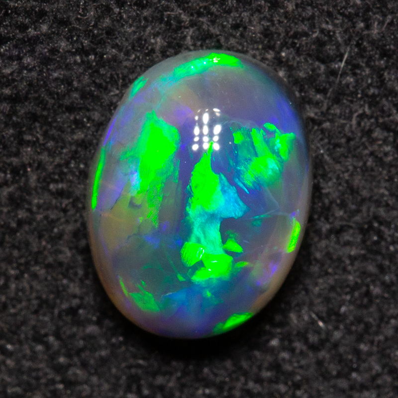 0.68 ct black opal 6.8x5.1x3mm