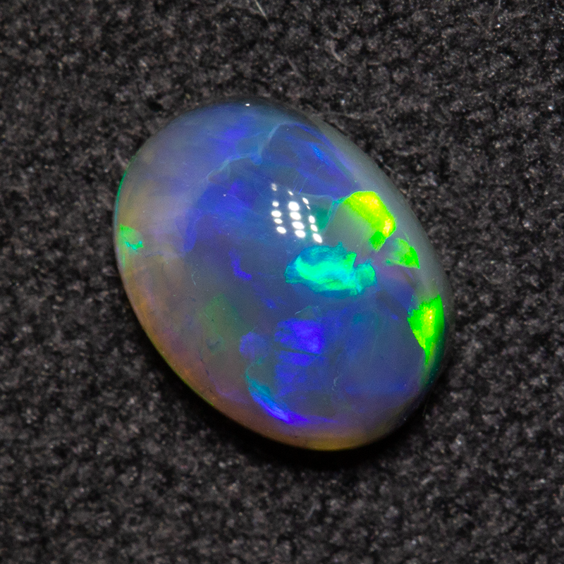 0.68 ct black opal 6.8x5.1x3mm