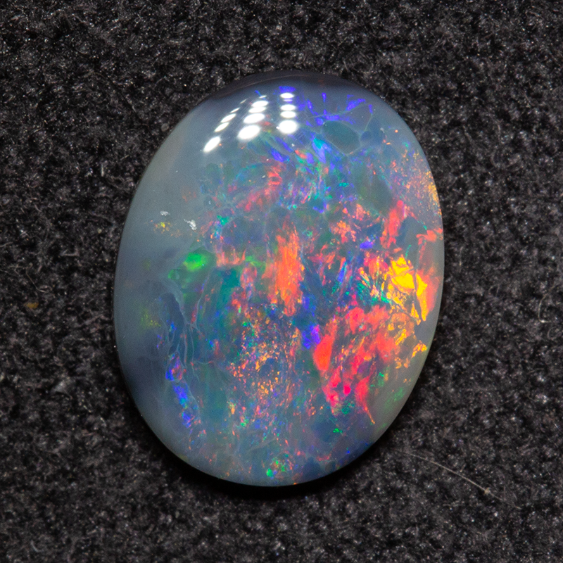 0.68 ct dark opal 8.2x6.4x1.9mm