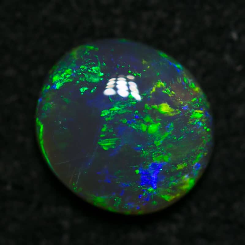 0.68 ct semi black opal 6.5x6x2mm