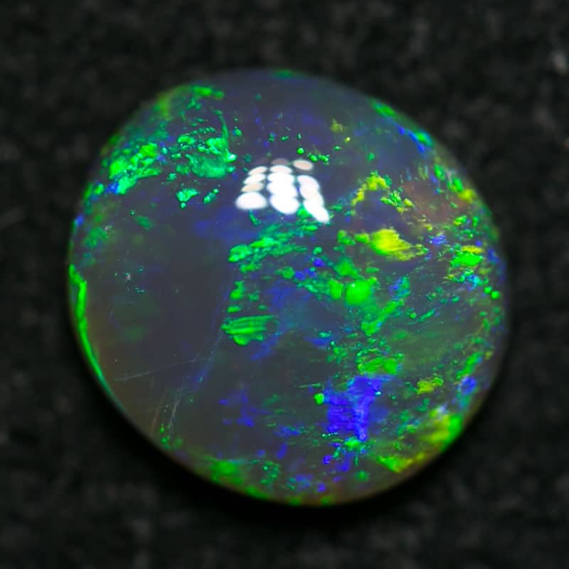 0.68 ct semi black opal 6.5x6x2mm