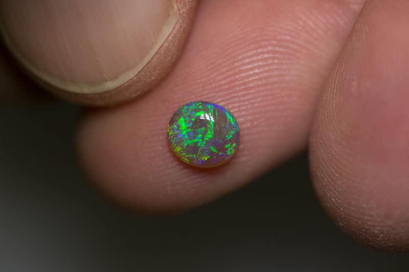 0.68 ct semi black opal 6.5x6x2mm