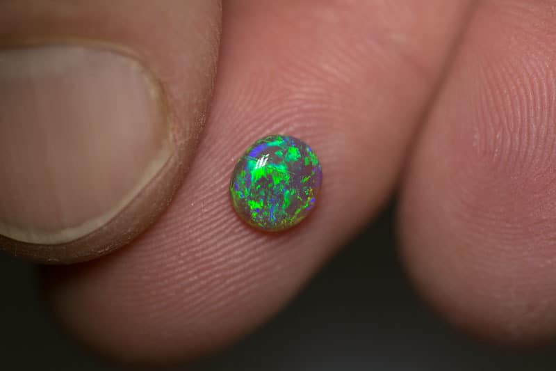 0.68 ct semi black opal 6.5x6x2mm