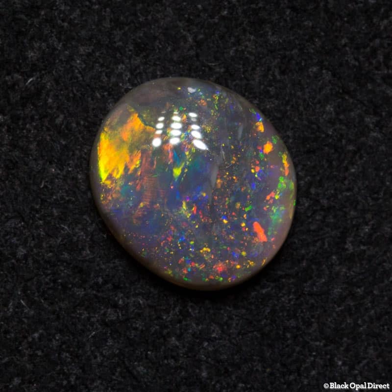 0.68 ct semi black opal 7x6x2mm