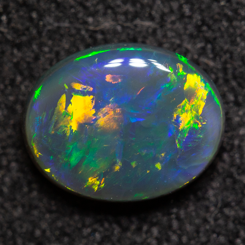0.70 ct black opal 6.9x5.4x2.7mm