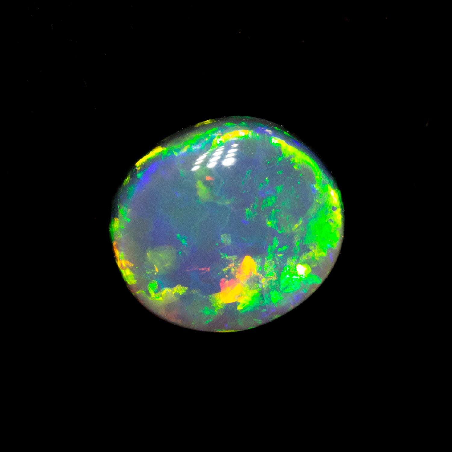 0.70 ct black opal 6.5x5.9x2.8mm