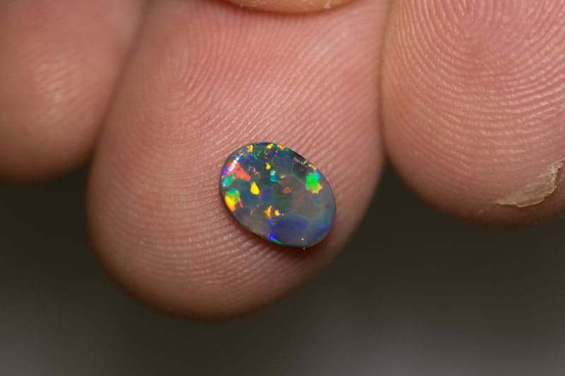 0.70 ct black opal 8x6x1.5mm