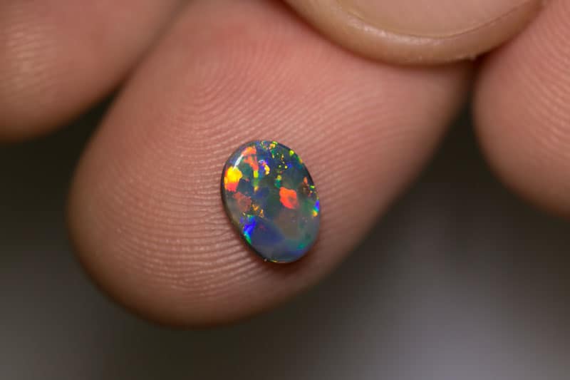 0.70 ct black opal 8x6x1.5mm
