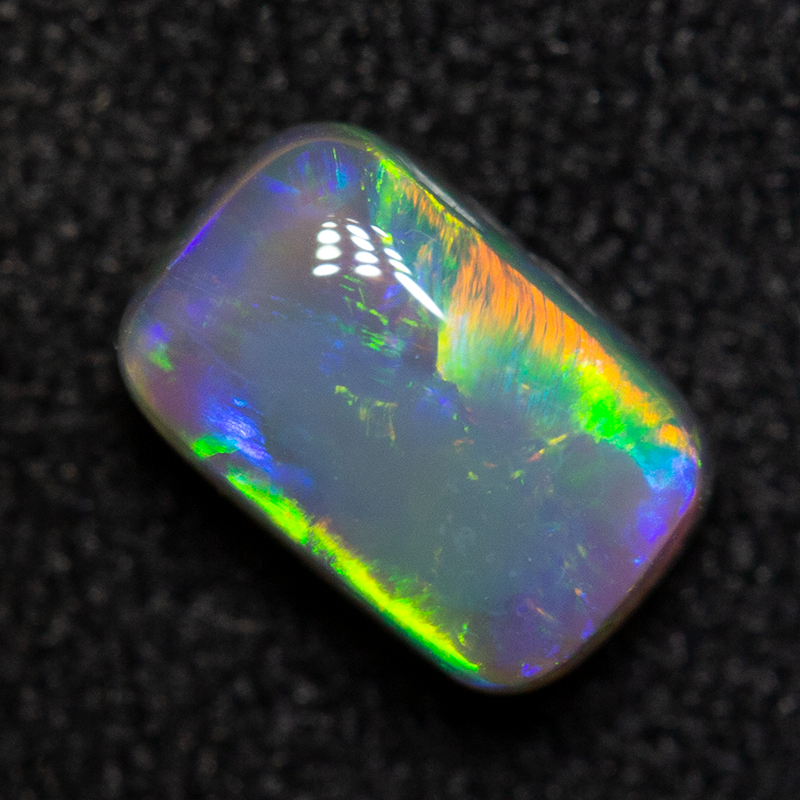 0.72 ct dark opal 6.4x4.1x3.2mm
