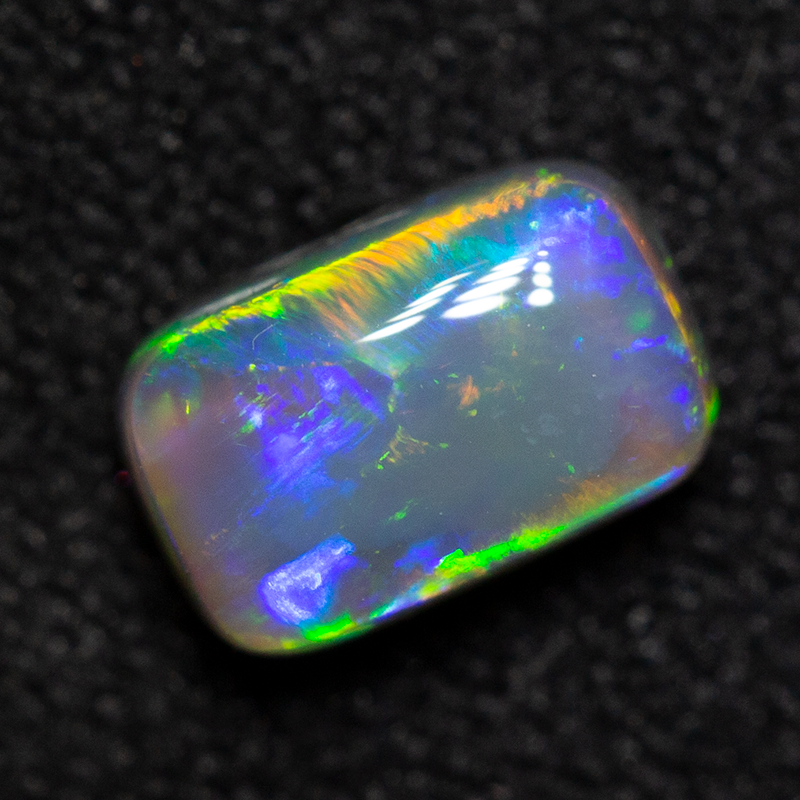 0.72 ct dark opal 6.4x4.1x3.2mm