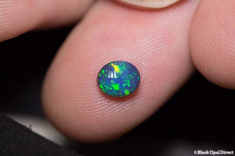 0.72 ct black opal 6.5x5.5x3mm