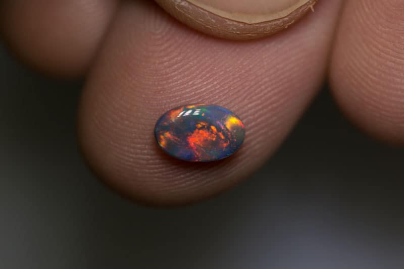 0.72 ct dark gem opal 8x5x2.5mm