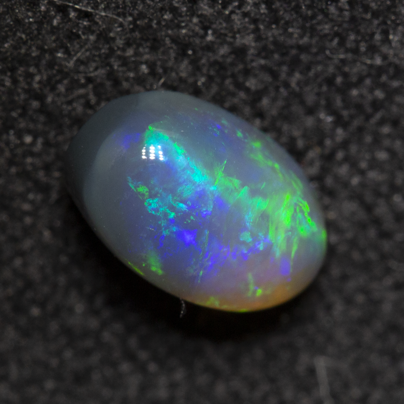 0.73 ct dark crystal opal 7.1x4.4x3.6mm