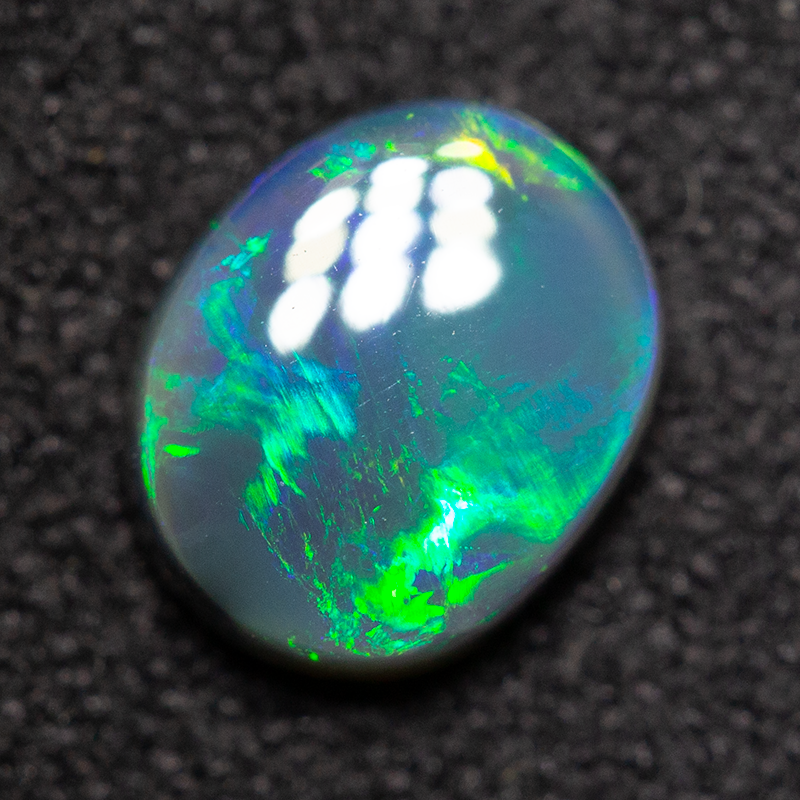 0.74 ct black opal 7x5.9x2.5mm