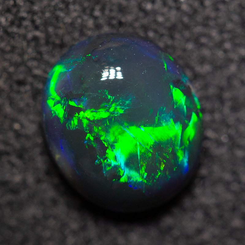0.74 ct black opal 7x6x3mm