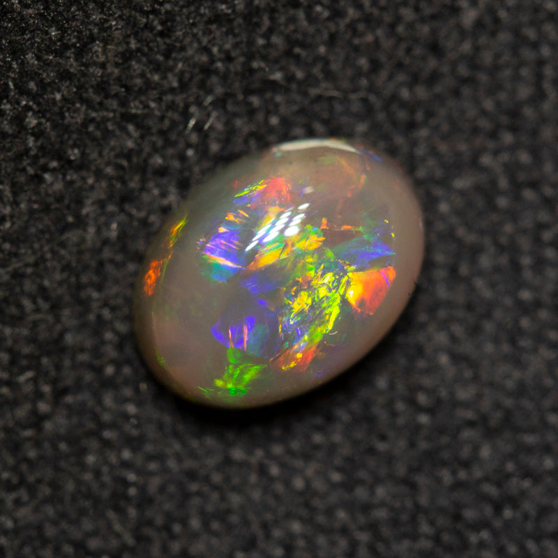 0.75 ct dark opal 6.9x5.1x3.2mm