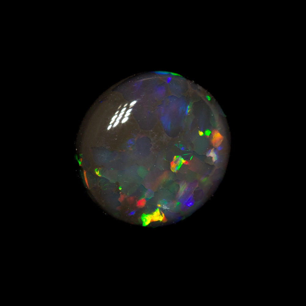 0.75 ct black opal 7.2x6.8x2.6mm