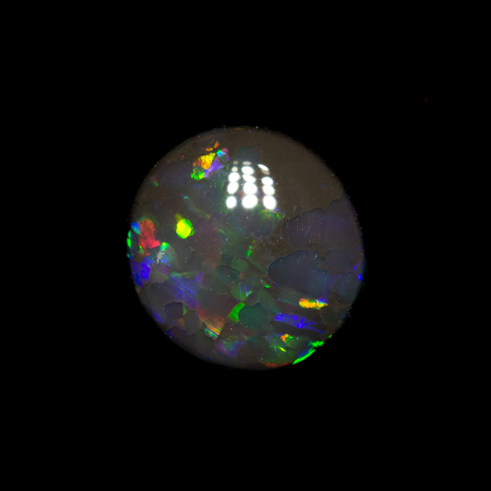 0.75 ct black opal 7.2x6.8x2.6mm