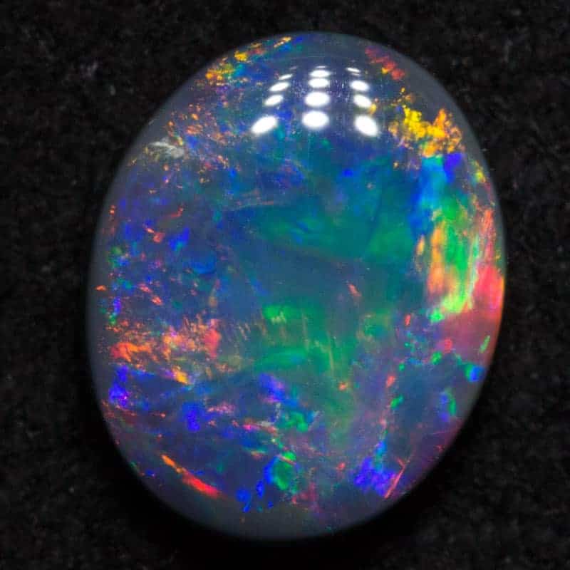 0.76 ct black opal 7x5.6x2.5mm