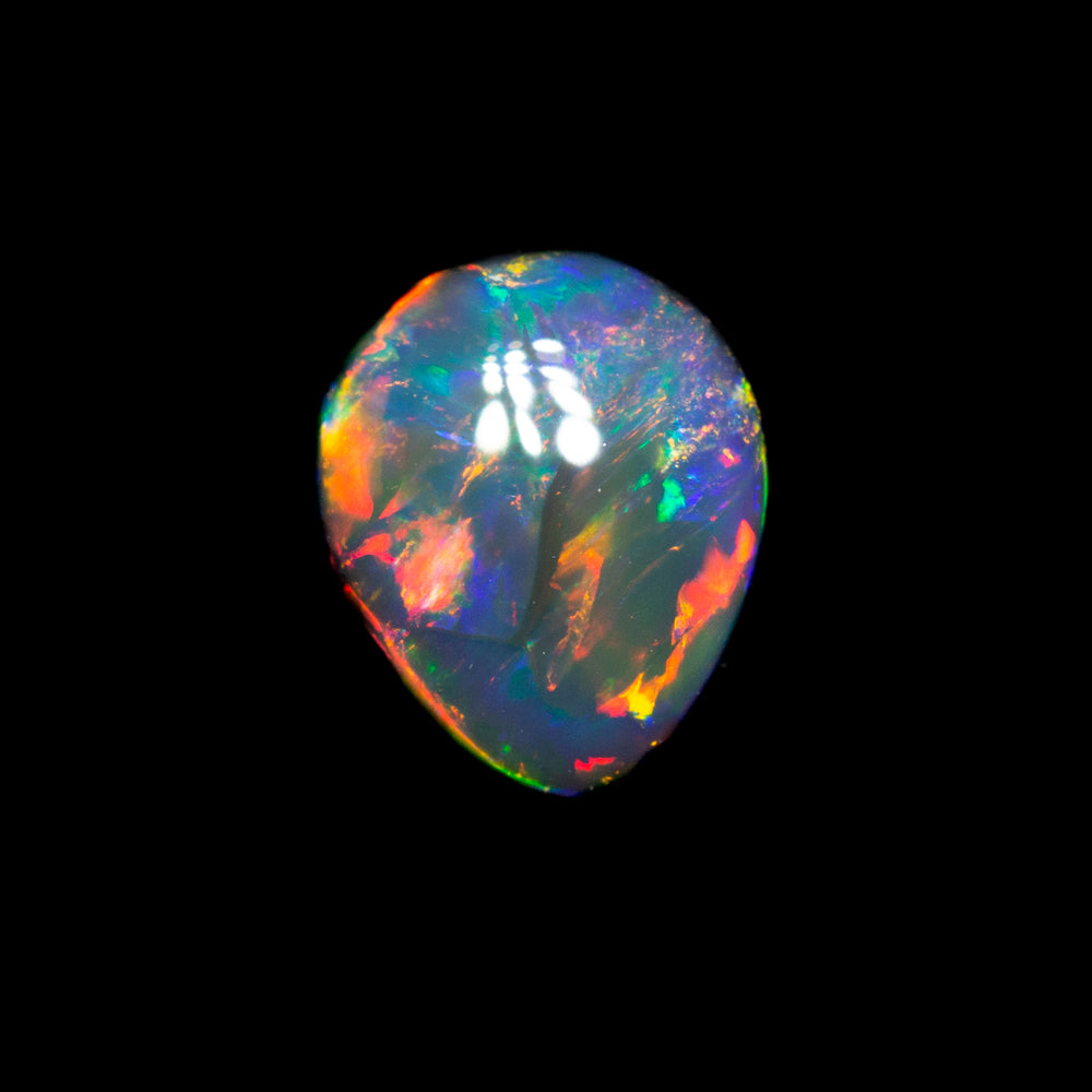 0.77 ct gem black opal 6.7x5.6x3.2mm