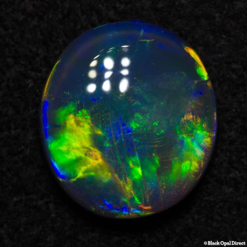 0.77 ct black opal gem 7x6.5x2mm