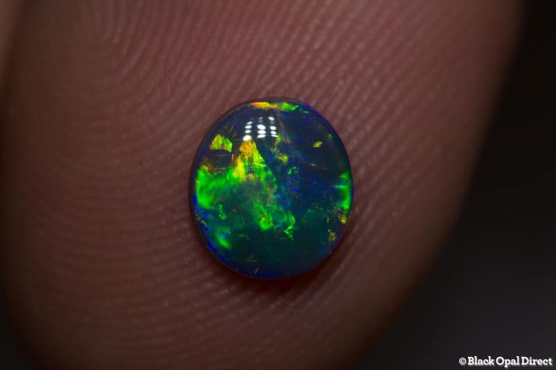 0.77 ct black opal gem 7x6.5x2mm