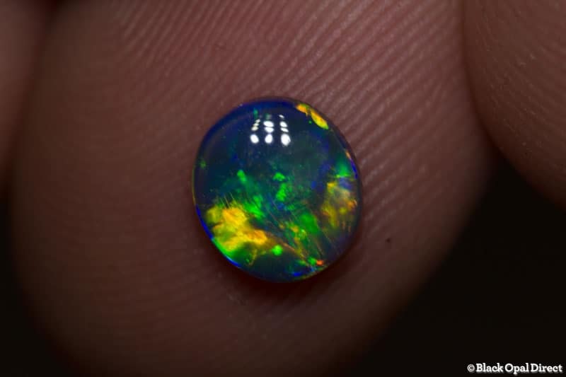 0.77 ct black opal gem 7x6.5x2mm