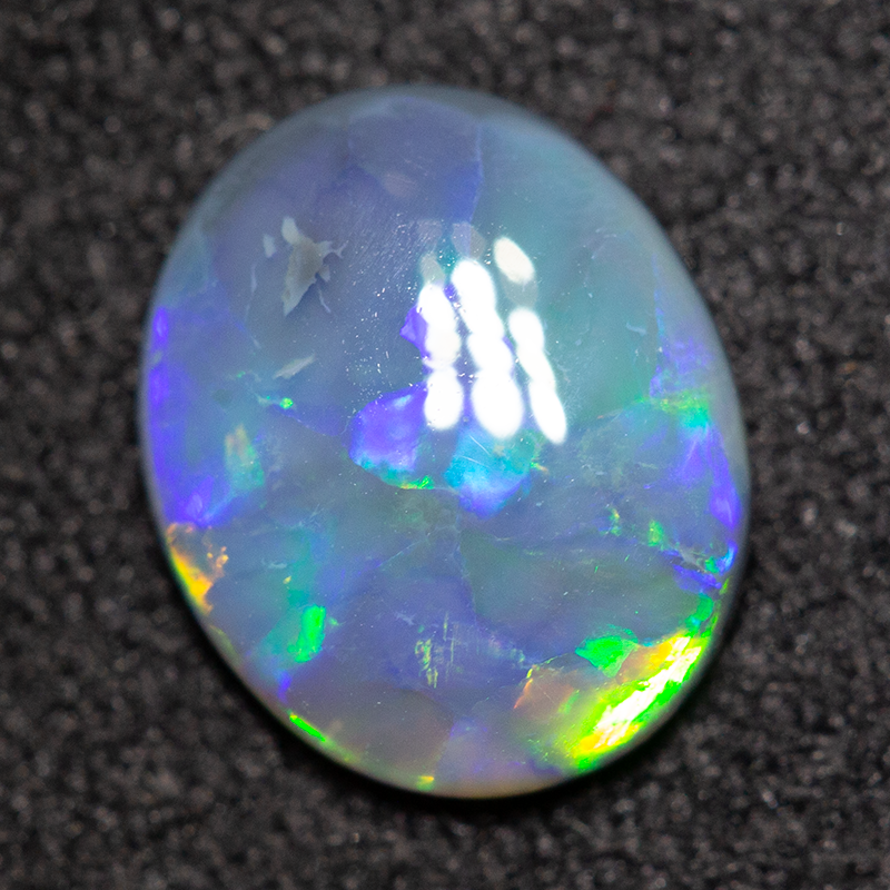0.79 ct black opal 8x7x2mm
