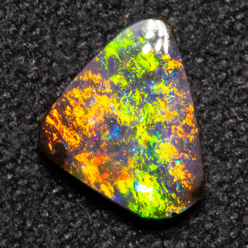 0.79 ct boulder opal 7.1x5.5x2.2mm