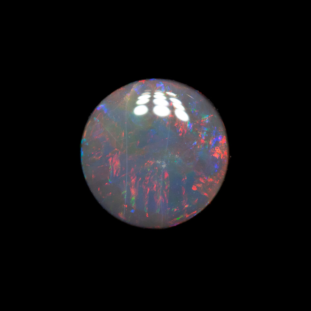 0.79 ct black opal 6.6x6.5x2.7mm