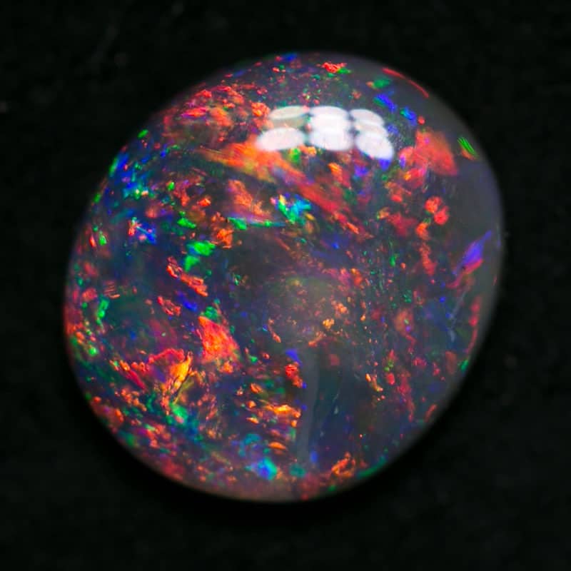 0.79 ct dark opal 7x6.5x2mm