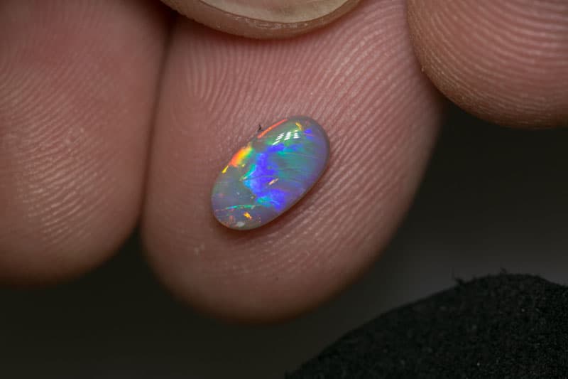 0.80 ct dark opal 9x5x2mm