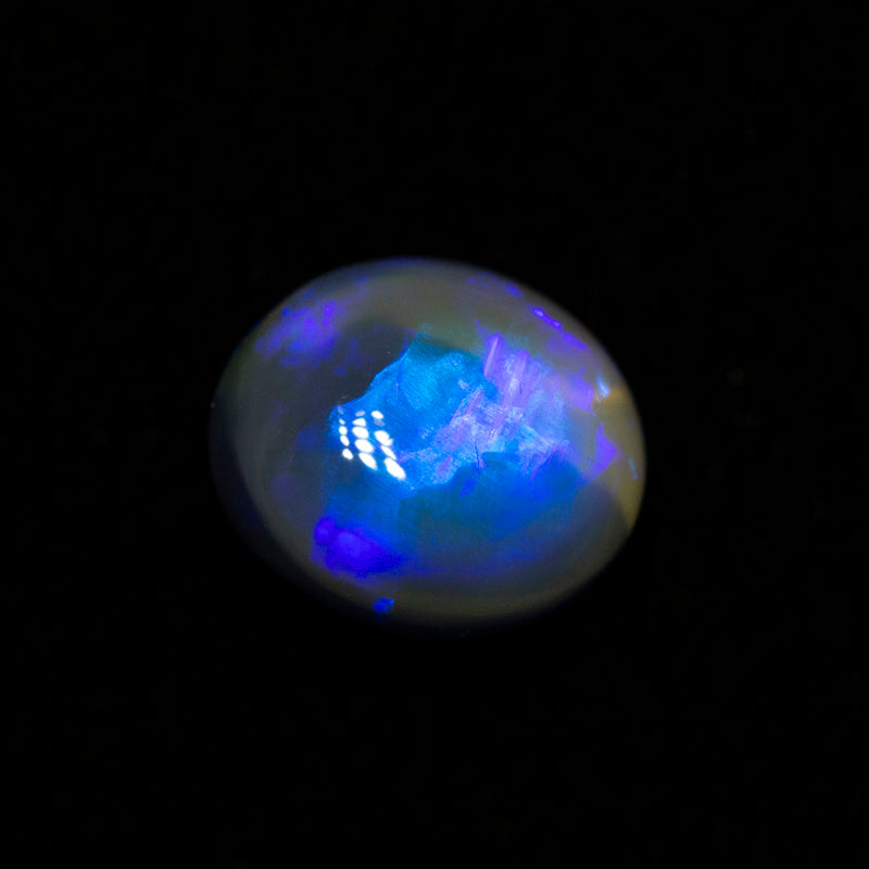 0.80 ct black opal 6.4x5.6x3.9mm