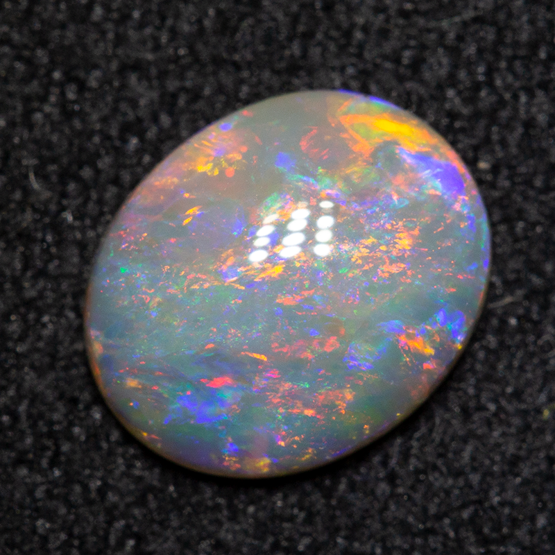 0.80 ct dark opal 7.9x6.5x2.4mm